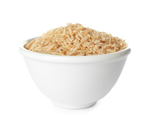 Bowl with brown rice on white background