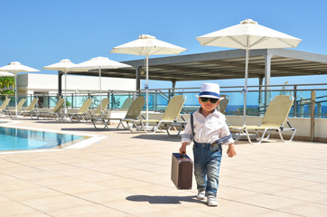 Little traveler at the pool....