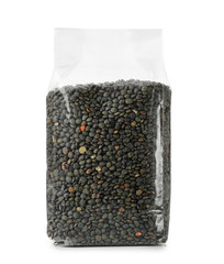 Plastic package with french green lentils on white background
