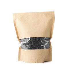 Paper package with black lentils on white background