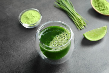 Wheat grass shot on grey background