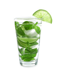 Cold fresh mojito with mint and lime slices in glass on white background