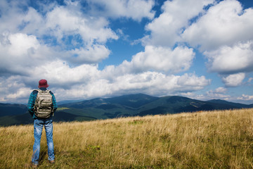 Hiking man in the mountains