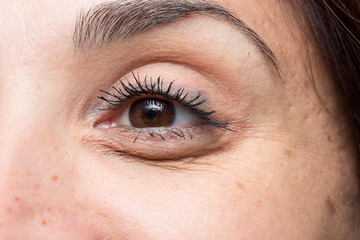Wrinkled eye of young woman