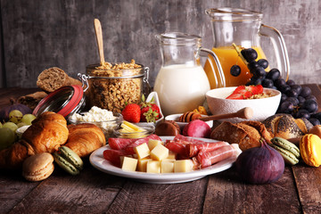 Breakfast served with coffee, orange juice, croissants, cereals