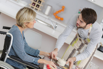nurse with woman helping with meal