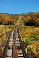 Fototapeta na wymiar A Cog Train and rail in White Mountains in fall, New Hampshire, USA.