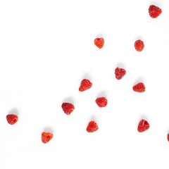 Raspberries on white background. Food blog or magazine concept texture.