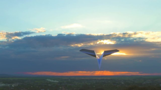 The hand launch paper airplane on stormy sunset  background. slow motion capture