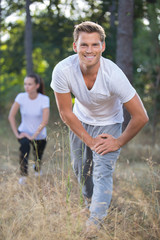 Fototapeta premium smiling couple stretching outdoors