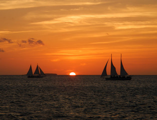 Obraz na płótnie Canvas Sailboats at Sunset