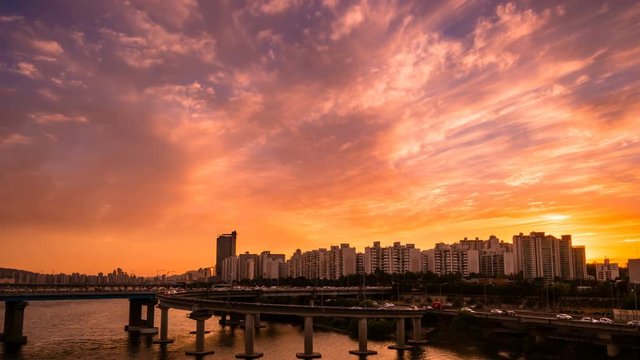Sunset landscape between Hangang road and apartments where the intersection of Seoul and South Korea is visible. Shoot with Timelapse.