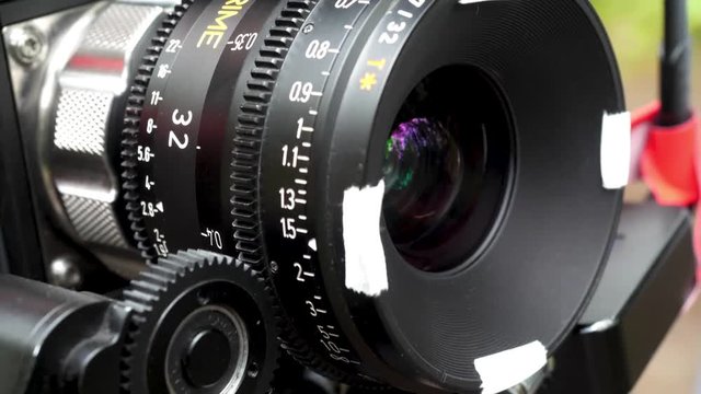 Digital camera lens. Television Film Camera with focus on the rim of the lens. Luxury lens on professional movie camera