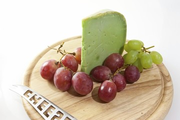 Spicy Japanese wasabi cheese on a board with grapes and bread