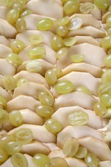 Apple slices and grapes on the dough, apple and grape slice