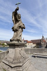 Obraz premium Alte Mainbruecke Main river bridge with statue of St. John of Nepomuk, Wuerzburg, Bavaria, Germany, Europe