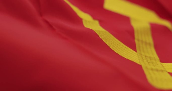 Soviet Russia flag detail with embroidered hammer and sickle as the symbol of communism.