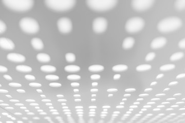 Bright light through white metal panel for blurred abstract pattern and blurred background. Perspective view. Selective focus