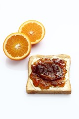 Two slices of toast, toasted slices of bread, with homemade orange marmalade