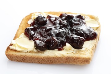 Slice of toast, toasted slice of bread, with cherry jam