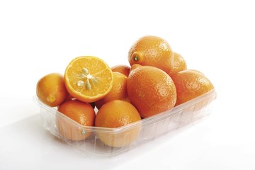 Kumquats in plastic bowls