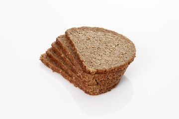 Five slices of whole-grain bread, stacked