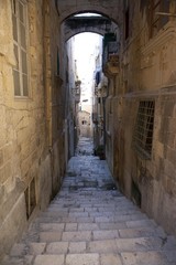 Narrow alley on St. Lucia Street, Valletta, Malta, Europe