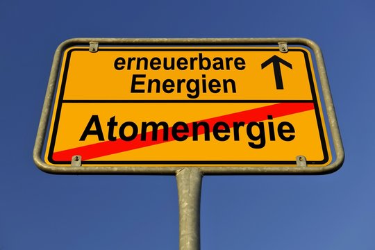 Symbolic image in the form of a town sign, in German, exit from atomic energy, entrance into renewable energy sources