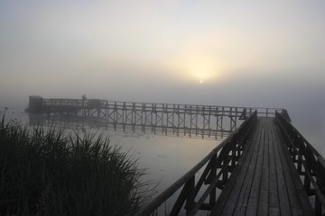 Sunrise seen from the Federsee pier, Federsee lake near Bad Buchau, nature reserve, district of Biberach, Upper Swabia, Baden-Wuerttemberg, Germany, Europe