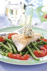 Redfish fillet with beans, tomatoes and herb butter
