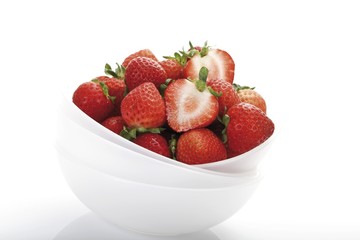 Fresh strawberries in a small bowl