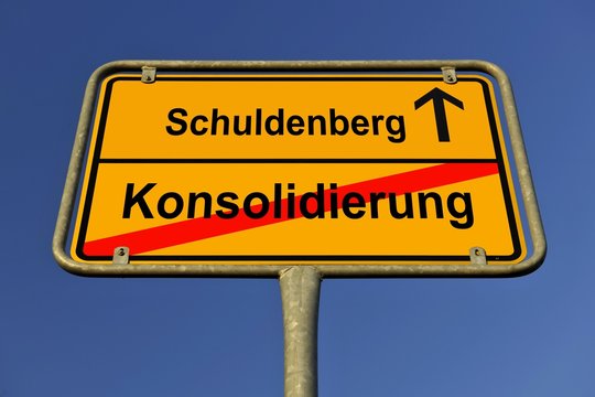 City limit sign, symbolic image in German for the conflict between debt and consolidation - Powered by Adobe