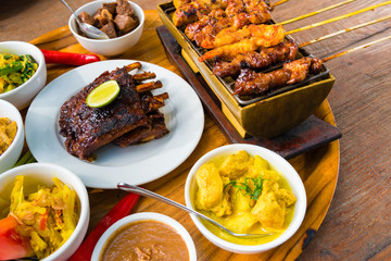 Traditional balinese sea food with satay and curry in Bali, Indonesia