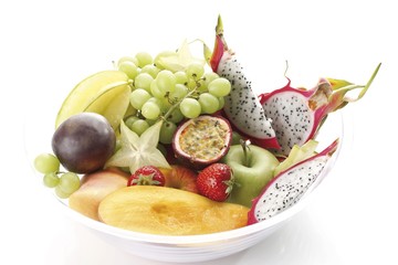 Fruit bowl, with exotic fruit, mango, pitahaya, carambolas, passion fruit, apples and grapes