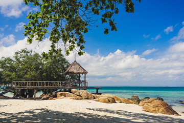 The cottage and wooden pathway with beautiful island in Rayong , Thailand.