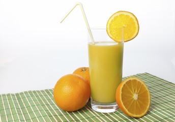 Oranges and orange juice in a glass