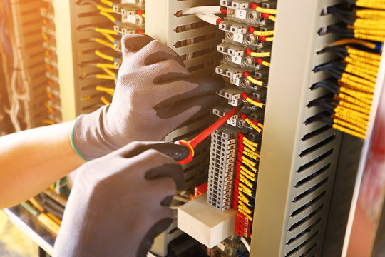 Electrical terminal in junction box and service by technician. Electrical device install in control panel for support program and control function by PLC. routine visit check equipment by technician.