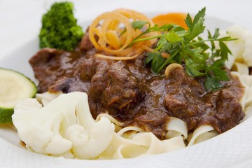 Boeuf bourguignon with pasta and vegetables