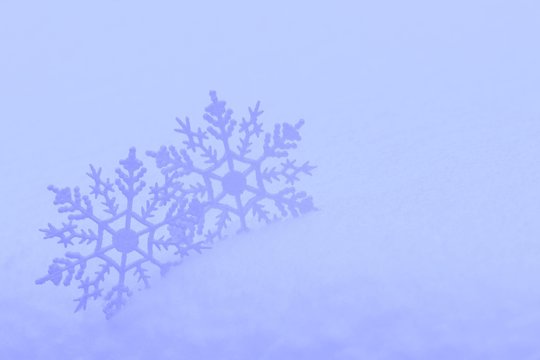 Decorative snowflakes in snow