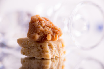 Macro detail of cannabis concentrate live resin extracted from medical marijuana over white