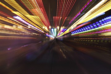 Bumper cars, zoomed, at night