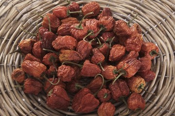 Dried mini peppers (capsicum) in a woven basket