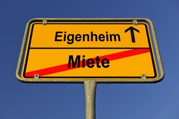 City limit sign, symbolic image for the way from Miete to Eigenheim, German for going from paying rent to owning your own home