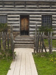 Fototapeta na wymiar Path leading to an old wooden country house door, Ontario Canada
