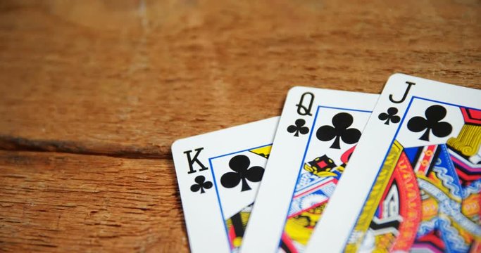 Playing cards on wooden table 