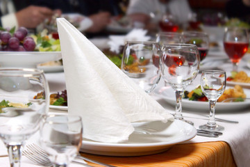 On a table in a plate there is a snack from seafood