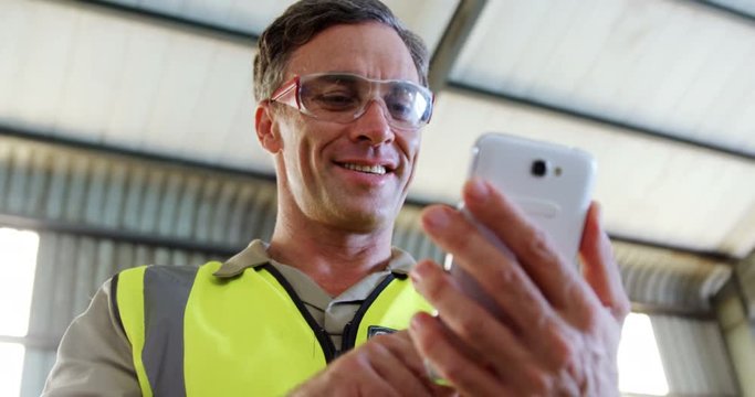 Worker using mobile phone