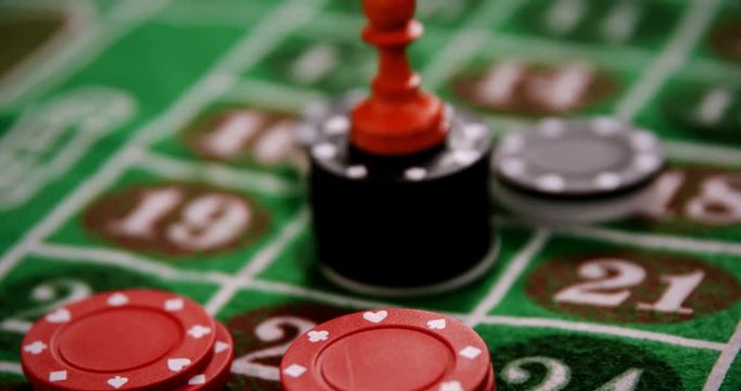 Casino chips on roulette on poker table 
