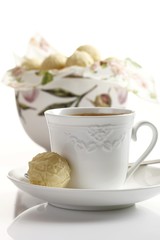 Chocolate truffles and a cup of coffee