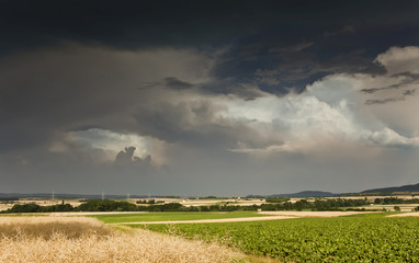 Thick storm clouds gathering over a farming area, Bavaria, Germany, Europe